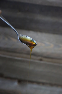 Organic Sidr Honey on a spoon Pasha International